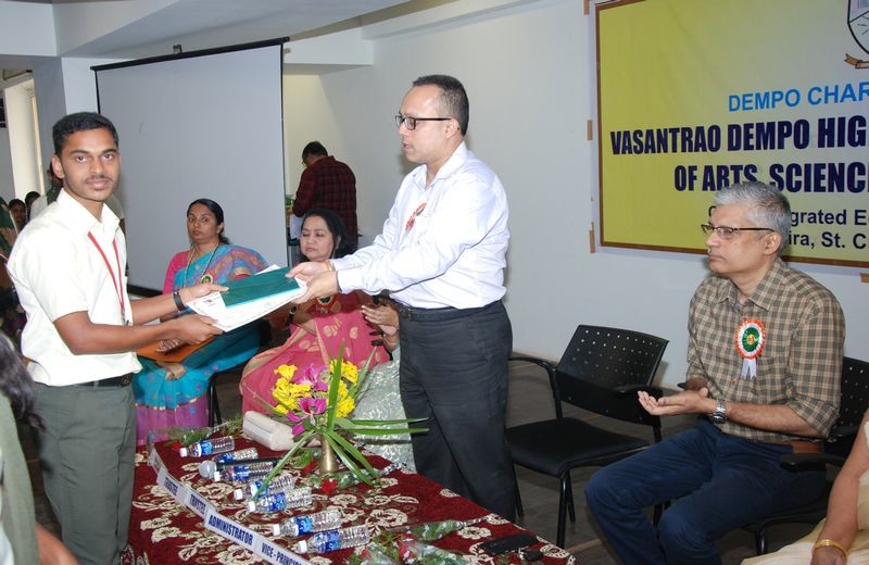 Student Mast. Arakhit Patro seen receiving a certificate at the hands of the Chief Guest of the Cultural Prize Distribution Ceremony, Mr. Yatish Dempo, Trustee of Dempo Charities Trust.